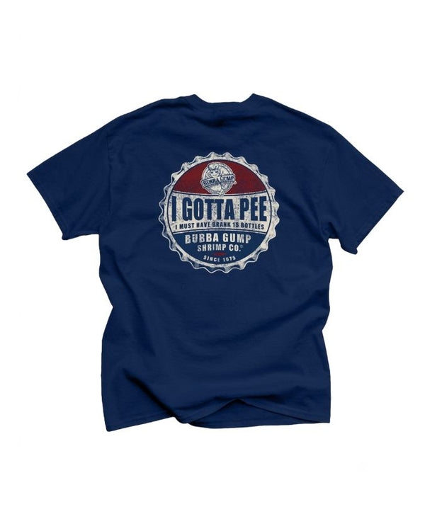 A backside view of a navy-blue crewneck T-shirt with a blue bottle cap in red, white and blue reading " I gotta Pee, i must have drank 15 bottle" and bottom part reads "bubba gump shrimp co since 1975". The background is plain white.