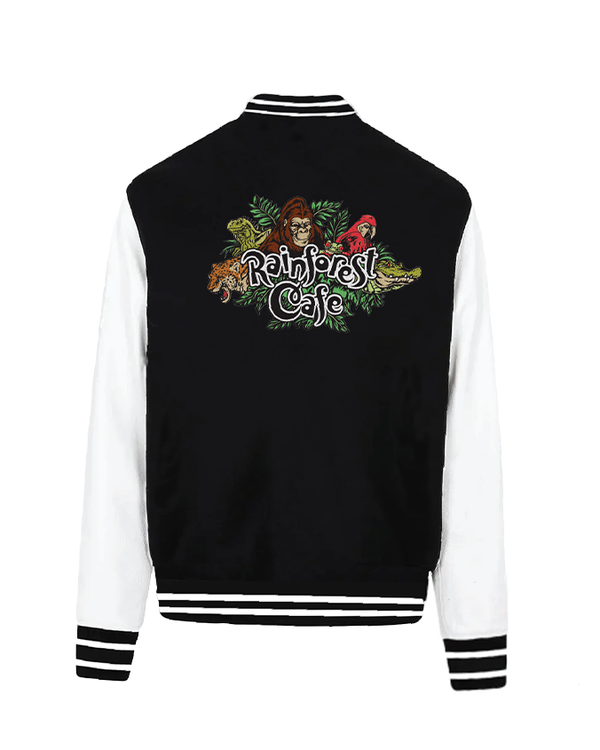 A black and white detailed letterman jacket with a colorful, embroidered design on the back featuring the text “Rainforest Cafe” in stylized lettering, surrounded by vibrant green foliage and jungle animals.
