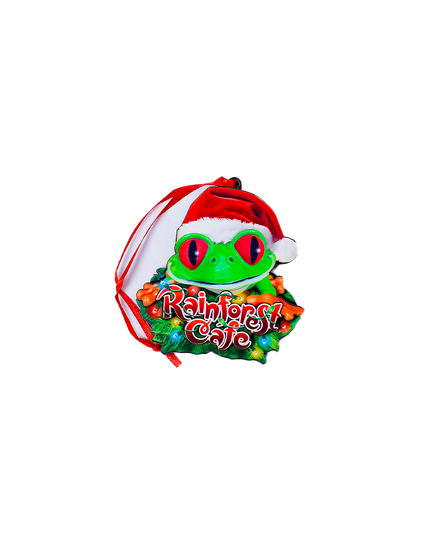 A vibrant green frog wearing a Santa hat, surrounded by colorful leaves, with "Rainforest Café" written underneath.