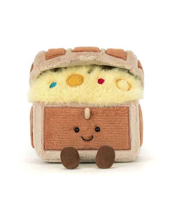 A plush toy treasure chest with feet, sitting against a white background, opened and revealing a fluffy yellow interior with colorful coins embedded in it.