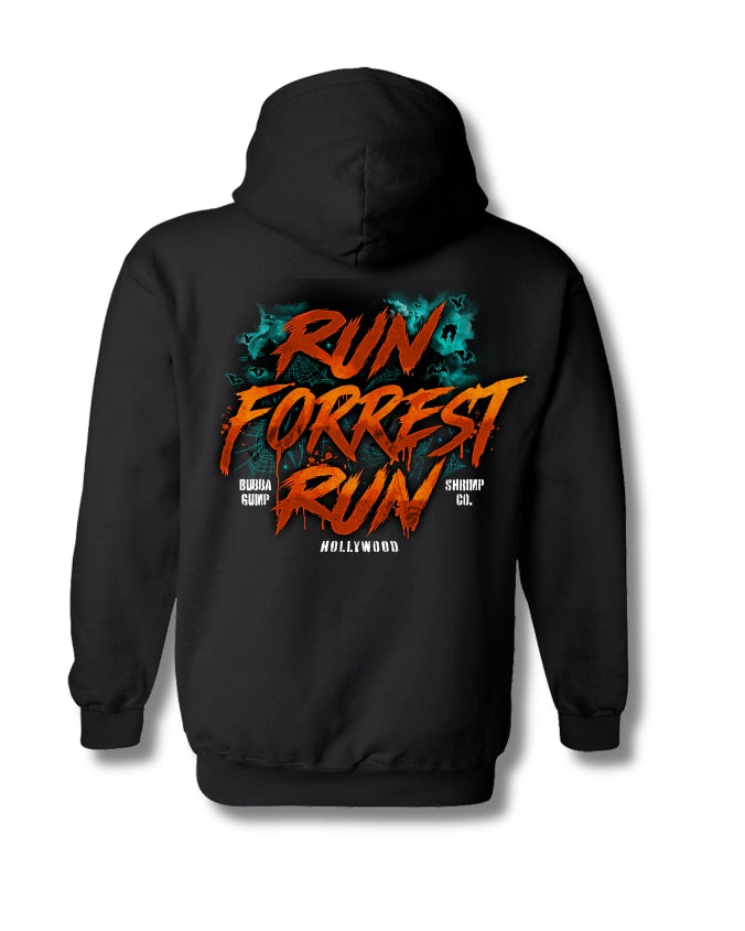 A black pullover hoodie shown from the back, featuring a large graphic print with the words 'RUN FORREST RUN' in orange and red distressed lettering, with teal splatter details and smaller white text reading 'HOLLYWOOD' on a white background.
