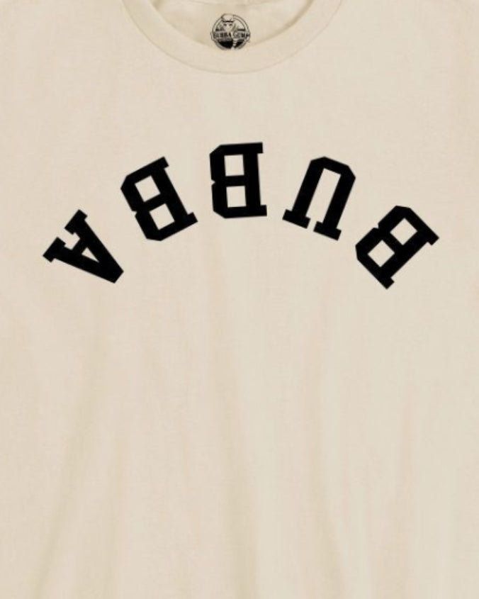 Close-up of an off-white crewneck t-shirt featuring the word 'BURGA' printed in large black varsity-style letters across the chest.