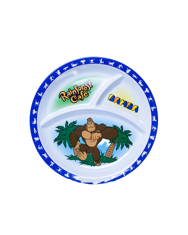 A colorful Rainforest Cafe themed plate featuring three compartments. The central compartment displays the Rainforest Cafe logo with a cartoon gorilla surrounded by green palm trees. Above the gorilla, the word ‘RAINFOREST’ is arched in bold yellow letters against a blue sky background with white clouds.