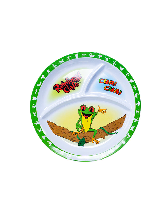 A colorful graphic of a plate with three distinct sections. The largest section at the bottom features an illustration of a green frog wearing a red bandana and striking a playful pose on a brown log. Above the frog, to the right, are the words ‘CHA CHA’ in bold red letters. The top left section contains the text ‘Rainforest Cafe’ in stylized green font with leaf motifs surrounding it.