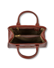 An open, empty brown leather handbag with a luxurious gold interior lining, featuring spacious compartments and a zippered section, elegantly displayed against a white background.