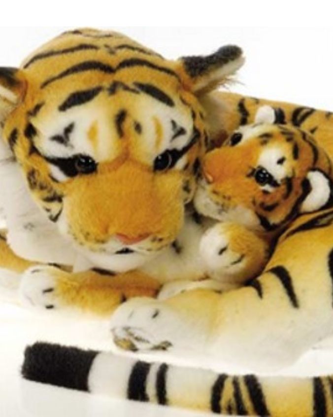 Plush tiger toy with a smaller tiger on its back, on a white background