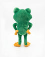 A green plush frog toy shown from the back, featuring orange-yellow hands and feet, photographed against a seamless white background.