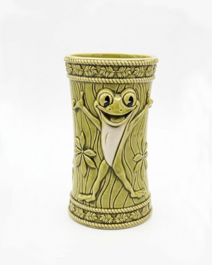 Decorative vase with a smiling face design on a white background