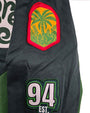 Green jacket with tropical leaf patch and number 94 on a white background