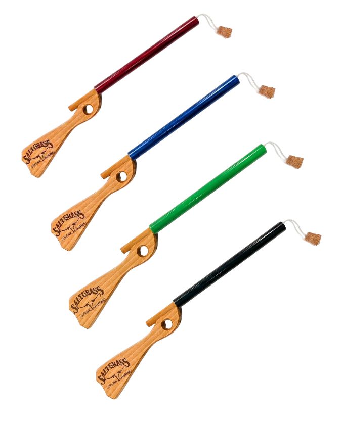Set of four wooden whips with colored handles on a white background