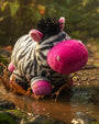 Plush toy zeppo with a pink nose splashing in water