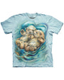 The central design on the shirt showcases two realistic otters, contently floating on their back, surrounded by swirling water patterns.