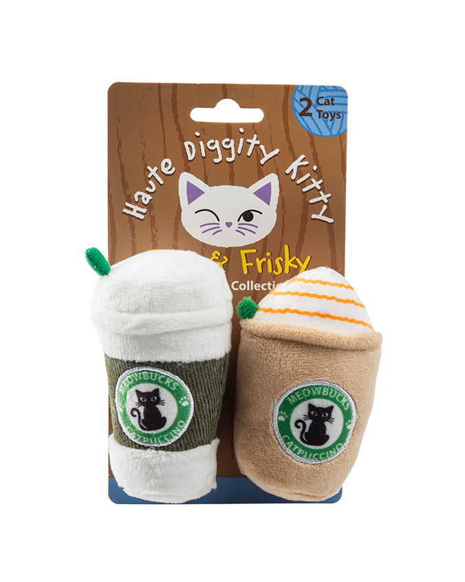 Two plush cat toys designed to resemble takeaway coffee cups are displayed against a cardboard backing. The left toy mimics a white whipped cream-topped frappuccino with a green straw, and the right one resembles an iced coffee with orange swirls, both featuring the parody logo “Meowbucks Catpuccino” with a black cat silhouette. 