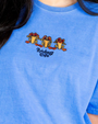 Blue t-shirt with cartoon frog design and 'Rainforest Cafe' text