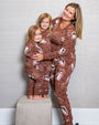 Mother hugging her two daughters from the side while wearing the Box of Chocolates pajama sets.